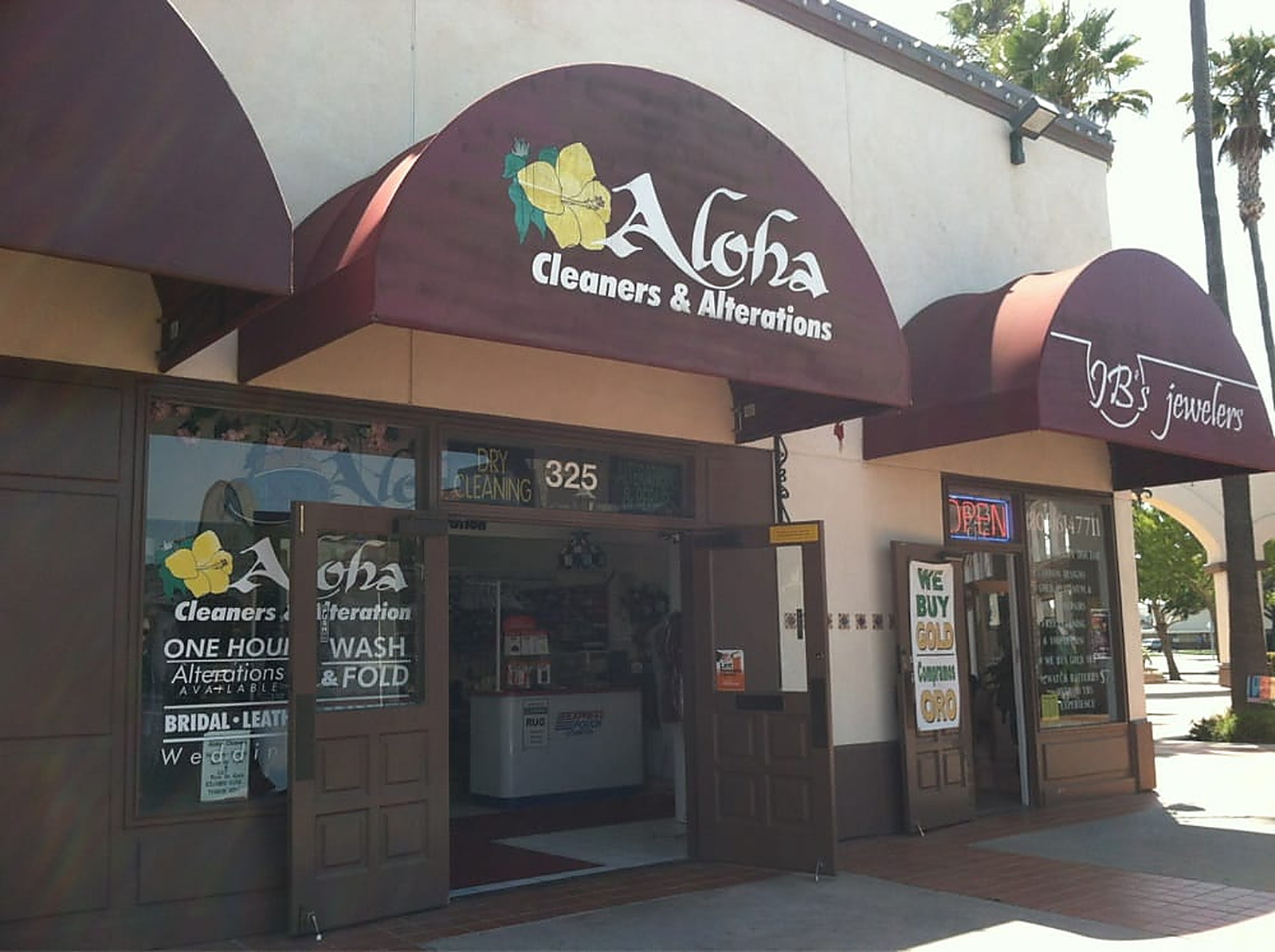 The Aloha Cleaners & Alterations storefront under its awning at number 325 on Town Center West
